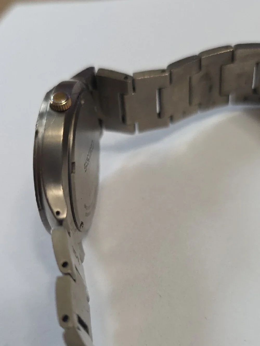 Seiko Titanium Watch with Black Dial and Gold Accents